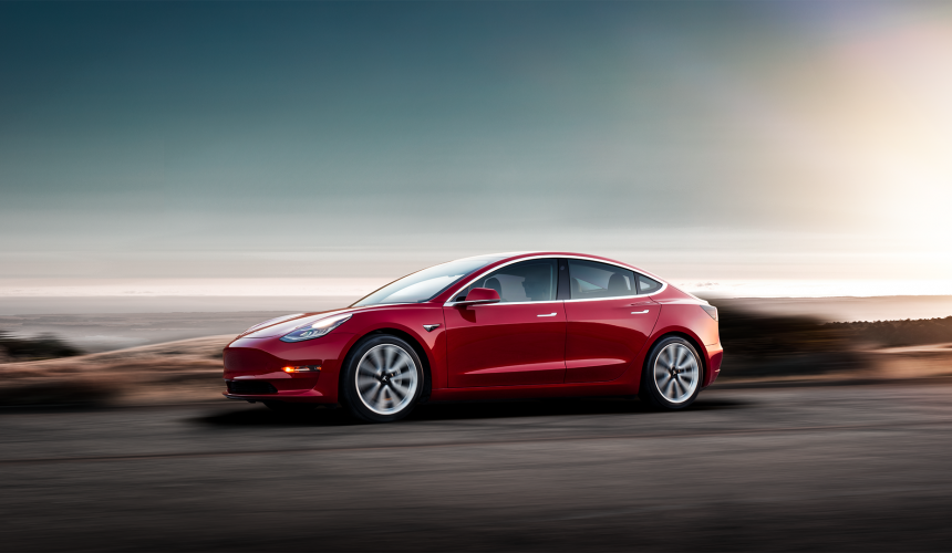 Tesla model 3 red side view